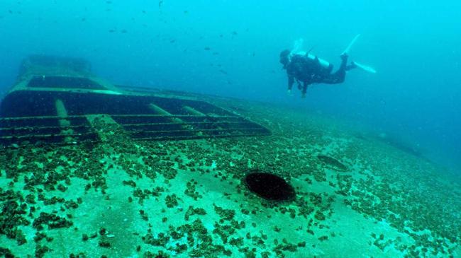 UNDERWATER WORLD: Rob McKinnon, assistant manager of Scuba World, diving the ex-HMAS Tobruk. Picture: Seanna Cronin