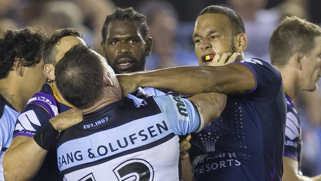 William Chambers of the Storm and Paul Gallen of the Sharks rumble at the end of the Round 4 NRL match between the Cronulla-Sutherland Sharks and the Melbourne Storm at Southern Cross Group Stadium in Sydney, Friday, March 30, 2018. (AAP Image/Craig Golding) NO ARCHIVING, EDITORIAL USE ONLY