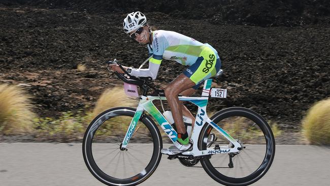 Turia Pitt rides through the lava fields during the bike leg. Pic: Michael Klein