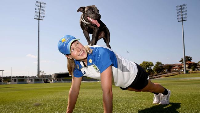 Ellyse Perry and her dog Nae Nae a 5-month-old Staffiy who will be getting plenty of exercise this month.