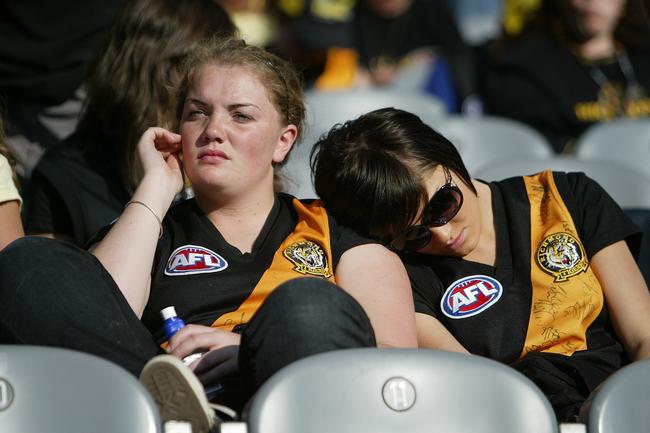 Friends console one another during a match against Melbourne.