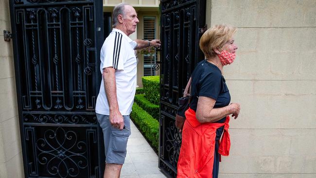 Warne's parents Keith and Bridgette leave the property after auction. Picture: Mark Stewart