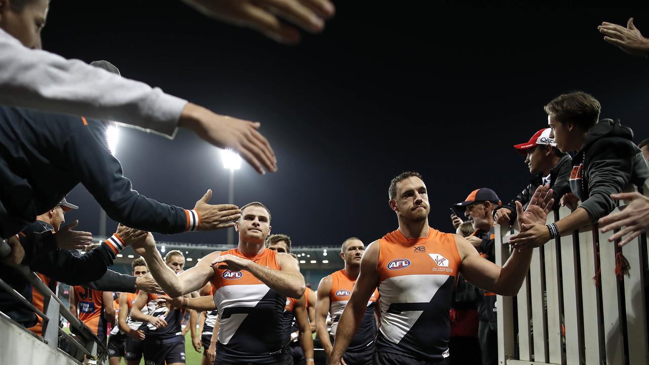 Heath Shaw and Shane Mumford celebrate after GWS’s win. Picture: Getty Images