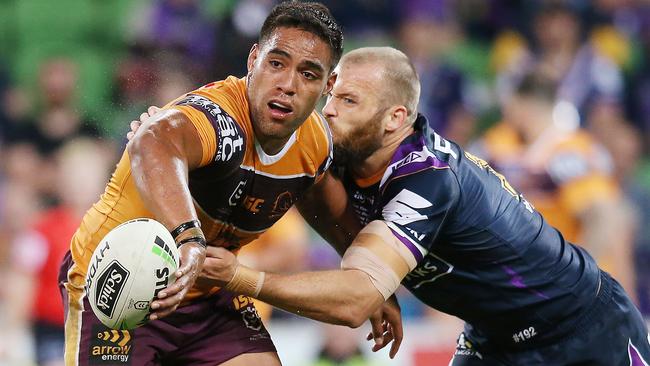 Broncos forward Joe Ofahengaue takes on the Storm defence at AAMI Park. Picture: Getty Images