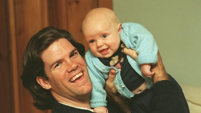 Paul Kahl with his son Elliott after announcing his retirement in 1996.