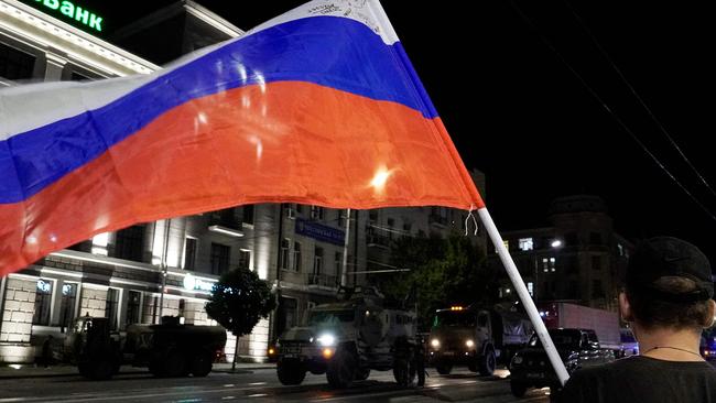 A man waves the Russian national flag as the Wagner Group retreat after the failed coup. Picture: Stringer/AFP