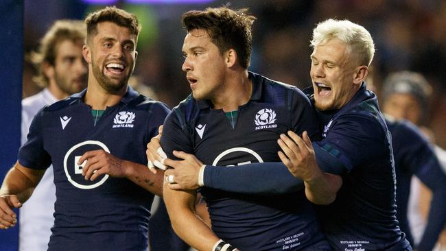 EDINBURGH, SCOTLAND - SEPTEMBER 06: Sam Johnson of Scotland (centre) scores try during the international match between Scotland and Georgia at Murrayfield on September 6, 2019 in Edinburgh, United Kingdom. (Photo by Robert Perry/Getty Images)