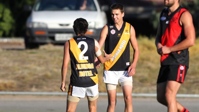 Matt Beinke (middle) during his early years with Aldinga in 2014. Picture: Stephen Laffer