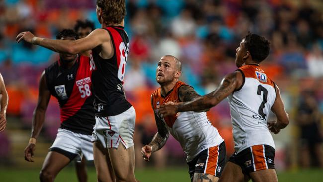 Jayden Magro eyes the ball as the NTFL Buffaloes' mens side beat the Essendon Bombers. Picture: Pema Tamang Pakhrin