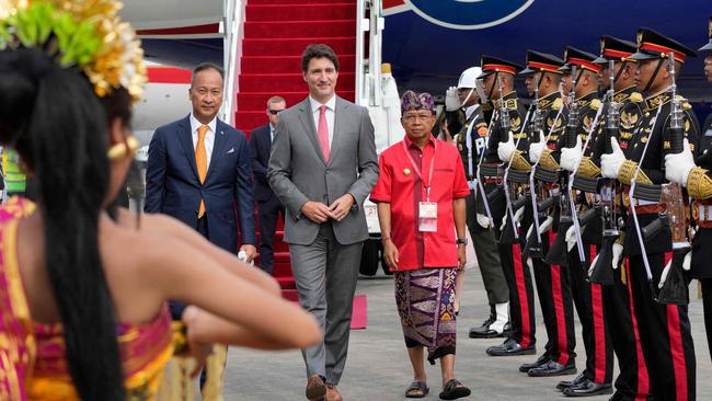 Canadian Prime Minister Justin Trudeau, centre, arrives at Ngurah Rai International airport in Denpasar on Monday. Picture: AFP