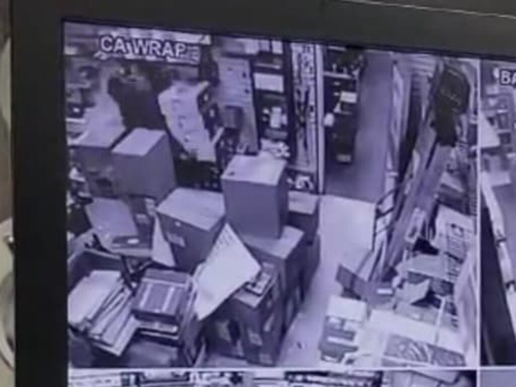 Surveillance footage of the incident showed the men stacking up PS5 consoles and leaving the building. Picture: Reddit