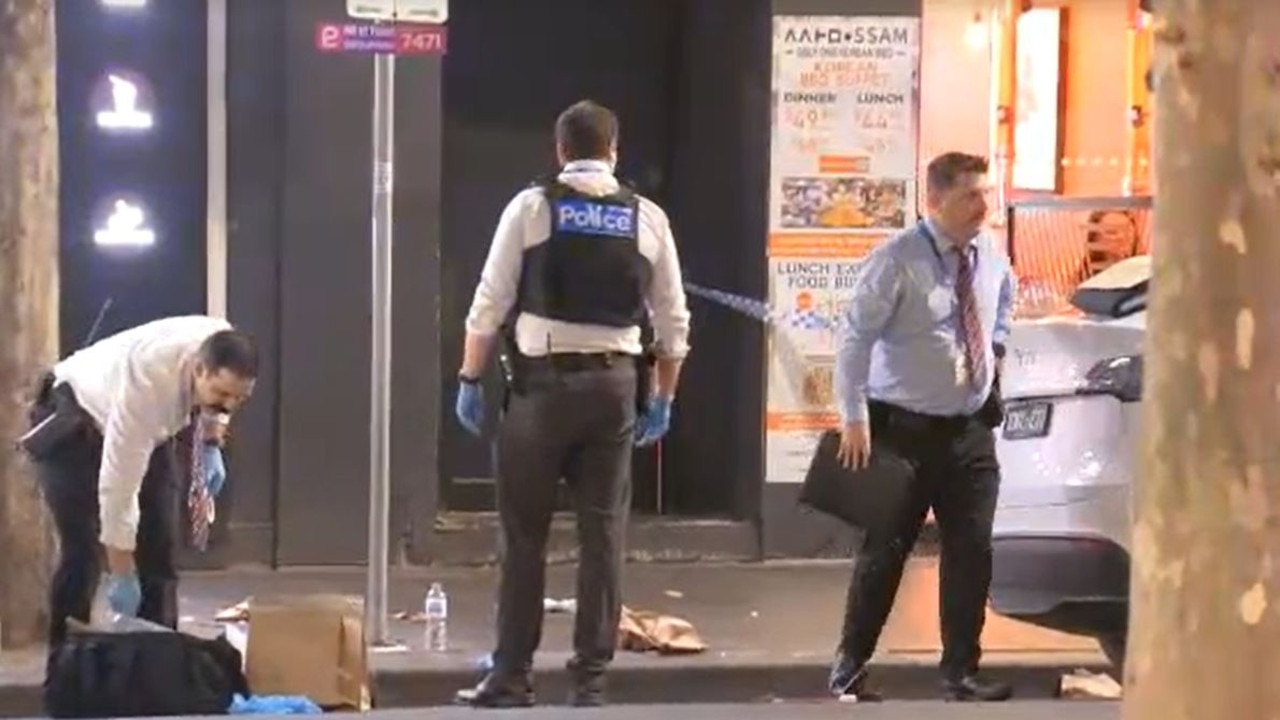 Police said the victims were attacked from behind. Officers at pictured at the scene. Picture: 9NEWS