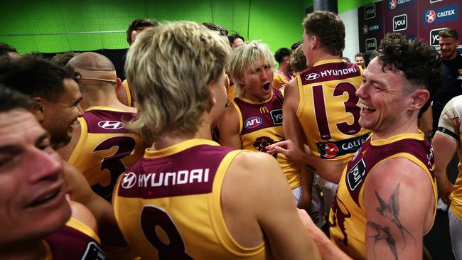 Kai Lohmann of the Lions, Will Ashcroft of the Lions and Lachie Neale celebrate their semi-final win over the Giants (Photo by Cameron Spencer/Getty Images) *** BESTPIX ***