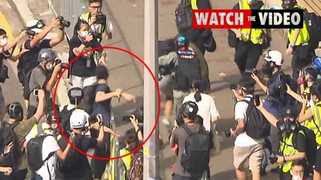 Moment Hong Kong Police officer is stabbed in the arm