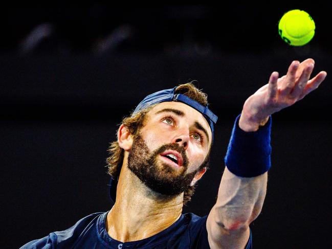 Jordan Thompson of Australia serves during his men's singles match against Grigor Dimitrov of Bulgaria at the Brisbane International tennis tournament in Brisbane on January 6, 2024. (Photo by Patrick HAMILTON / AFP) / --IMAGE RESTRICTED TO EDITORIAL USE - STRICTLY NO COMMERCIAL USE--