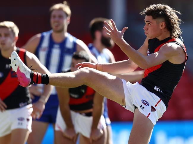 AFL Round 18. North Melbourne vs Essendon at Metricon stadium, Gold Coast . 18/07/2021.   Sam Durham of the Bombers  kicks at goal   .  Pic: Michael Klein