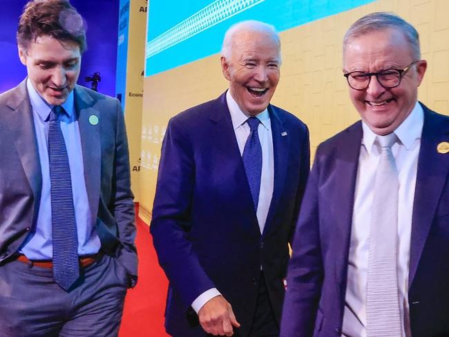 This handout picture released by the Peruvian news agency Andina shows US President Joe Biden (C), Canada's Prime Minster Justin Trudeau and Australian Prime Minister Anthony Albanese smiling during the APEC Summit at the Convention Centre in Lima, on November 15, 2024. (Photo by ANDRES VALLE / ANDINA / AFP) / RESTRICTED TO EDITORIAL USE - MANDATORY CREDIT "AFP PHOTO / ANDINA / ANDRES VALLE" - NO MARKETING - NO ADVERTISING CAMPAIGNS - DISTRIBUTED AS A SERVICE TO CLIENTS