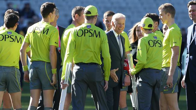 Joe Biden meets the umpires before the Blue-Eagles clash. Picture: Michael Klein