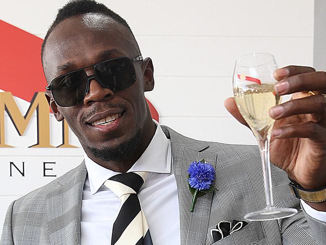 Melbourne Racing Spring Carnival. Derby Day in The Birdcage at Flemington Racecourse. Usain Bolt toasts with some champagne.Picture : Ian Currie