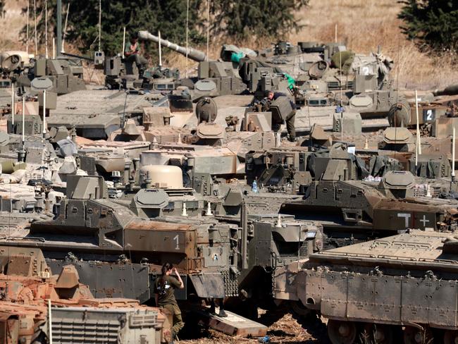 Israeli army tanks and armoured vehicles deployed in the Upper Galilee region of northern Israel near the border with Lebanon. Picture: AFP