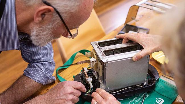 Hands on: Bendigo Repair Cafe’s Andrew Lewis fixes a toaster. Picture: Josh Robenstone