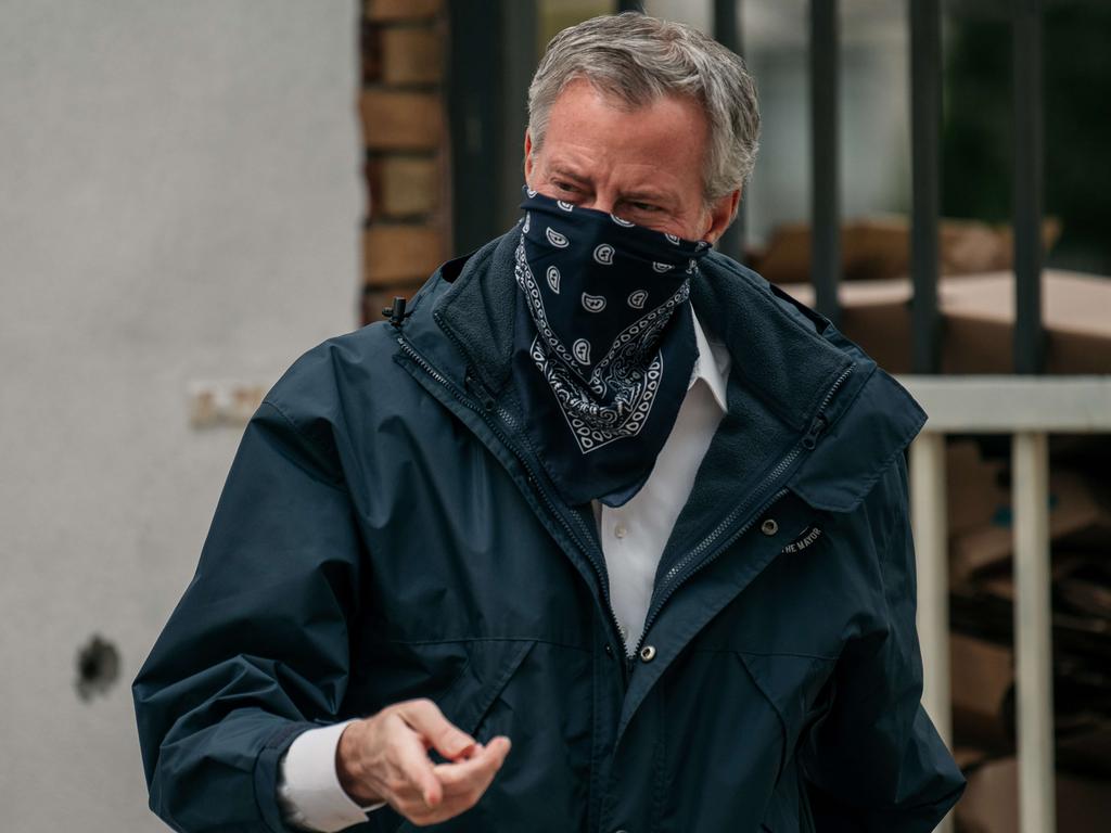 New York City Mayor Bill de Blasio wears a bandana while speaking at a food shelf organised by The Campaign Against Hunger in Brooklyn. Picture: Getty Images