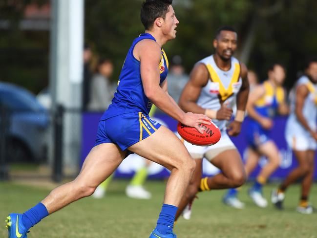 Jackson Sketcher (left) of Noble Park is is seen in action during the Eastern Football League match at Nobel Park Reserve, Melbourne, Saturday, June 2, 2018. Noble Park v Rowville. (AAP Image/James Ross) NO ARCHIVING