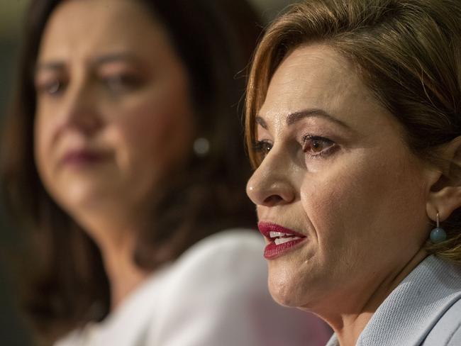 Queensland Premier Annastacia Palaszczuk and Treasurer Jackie Trad (right) speak during the state government's 2019-20 Queensland budget media briefing in Brisbane, Tuesday, June 11, 2019. (AAP Image/Glenn Hunt) NO ARCHIVING