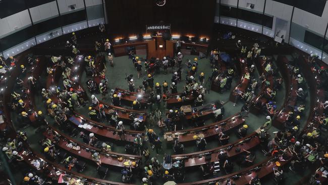 Protesters gather inside the meeting hall of the Legislative Council. Picture: AP