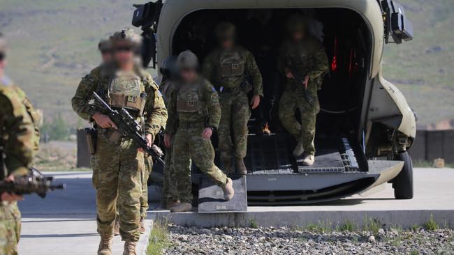 Australian Special Forces soldiers aboard a NATO Chinook helicopter at Camp Qargha near Kabul. Picture: Gary Ramage