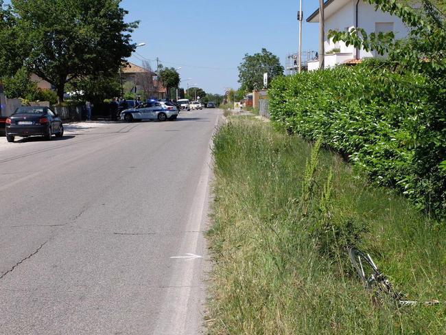 The bicycle of Nicky Hayden lies next to the road, bottom right, after been hitting by a car.