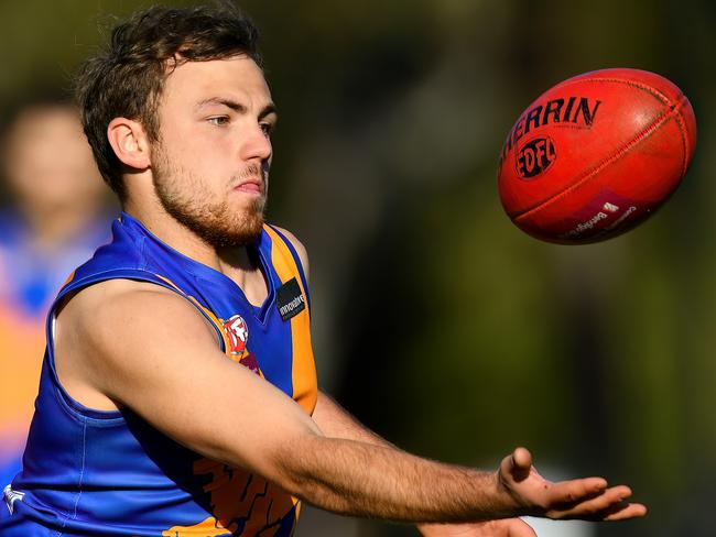 Samuel Kosmak of Taylors Lakes gathers the ball during the round six EDFL Strathmore Community Bank Division Two match between Hadfield and Taylors Lakes at Martin Reserve, on May 18, 2024, in Melbourne, Australia. (Photo by Josh Chadwick)