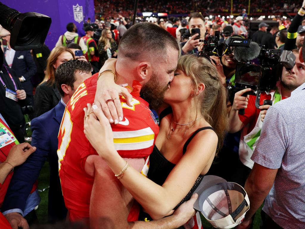 <p>Travis Kelce (#87) of the Kansas City Chiefs and Taylor Swift share a victorious PDA after taking down the San Francisco 49ers in an electrifying Super Bowl LVIII overtime showdown at Allegiant Stadium on February 11, 2024, in Las Vegas, Nevada. Photo: Ezra Shaw/Getty Images.</p>