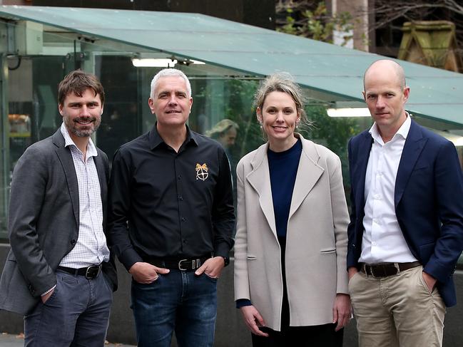 Uber has reached a landmark agreement with the union on minimum pay for drivers and collective bargaining. (L-R) TWU national assistant Nick McIntosh and national secretary Michael Kaine with Uber general manager Dom Taylor and Uber Eats general manager Bec Nyst. Jane Dempster.