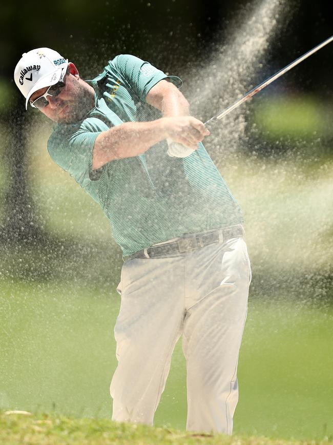 Marc Leishman plays from the bunker at the 2018 Australia PGA Championship at Royal Pines Resort on the Gold Coast on Thursday. Picture: Chris Hyde/Getty Images