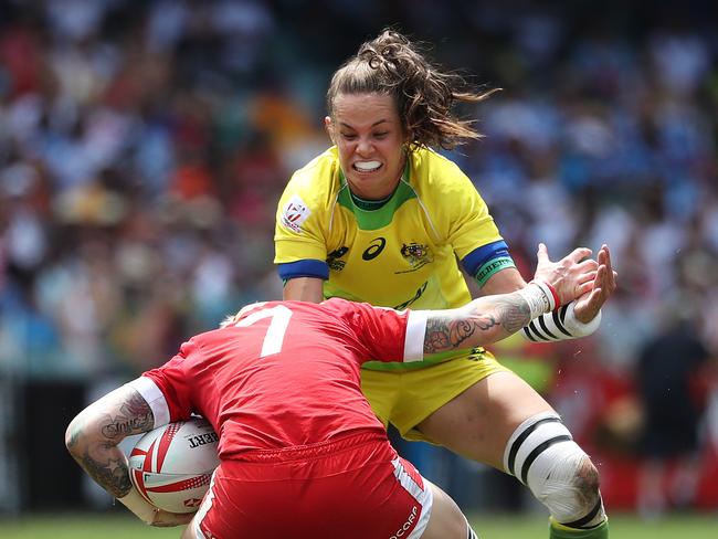 Australia's Chloe Dalton tackles Canada's Jennifer Kish during the Sydney Sevens event earlier this year. Pic: Brett Costello