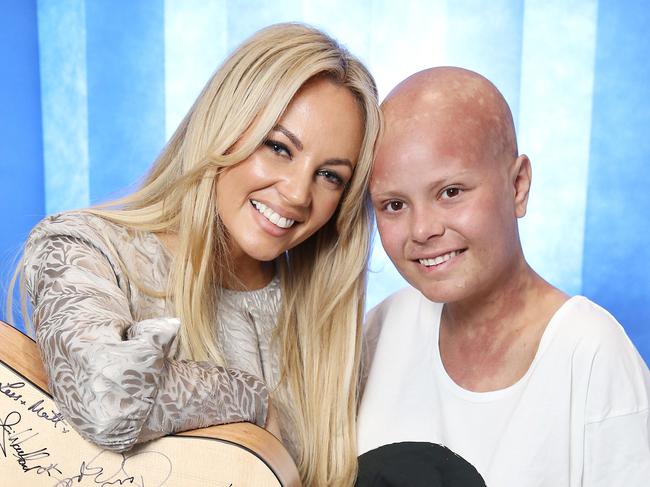 Samantha Jade with patient Zoie Moore (18) Sydney Children's Hospital, Randwick. Aussie pop star Samantha Jade, an ambassador for the Sony Foundation,  a guitar which has been signed by all the artists involved in the Sony charity single, that will be auctioned off.