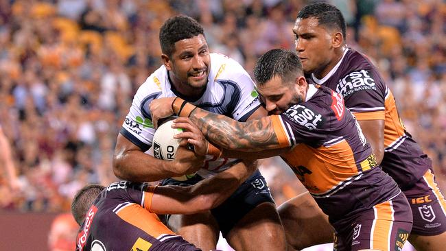 BRISBANE, AUSTRALIA - MARCH 22: Nene Macdonald of the Cowboys is caught in the in-goal area during the round two NRL match between the Brisbane Broncos and the North Queensland Cowboys at Suncorp Stadium on March 22, 2019 in Brisbane, Australia. (Photo by Bradley Kanaris/Getty Images)