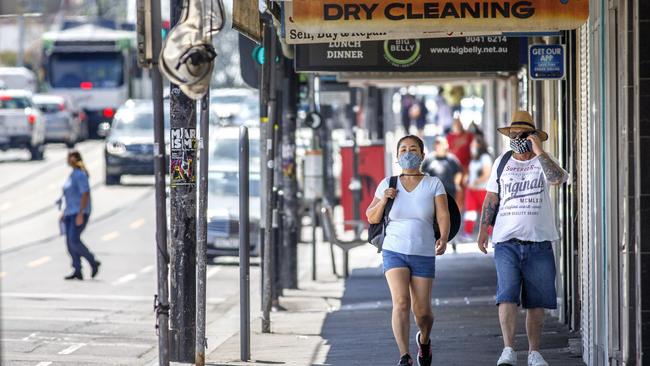 People wearing face masks in Sydney Rd Coburg yesterday. Picture: NCA NewsWire / David Geraghty