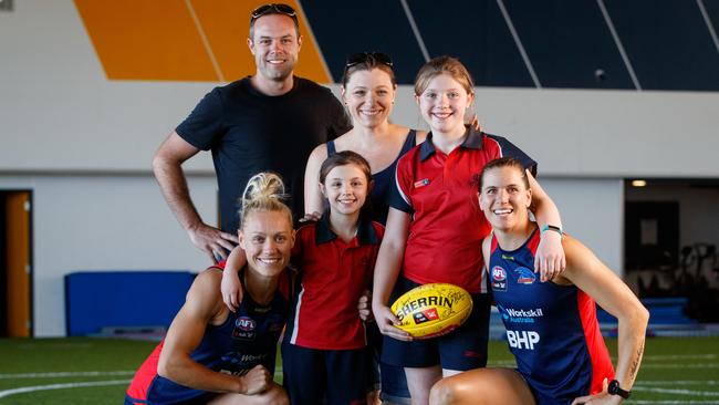 AFLW Crows co-captains Erin Phillips and Chelsea Randall with Josh and Jess Taylor and children Matilda, 11, and Katelyn, 7. The Taylor family, of Lobethal, lost most of their possession's including Matilda’s favourite football in the Cudlee Creek bushfire. Picture Matt Turner.