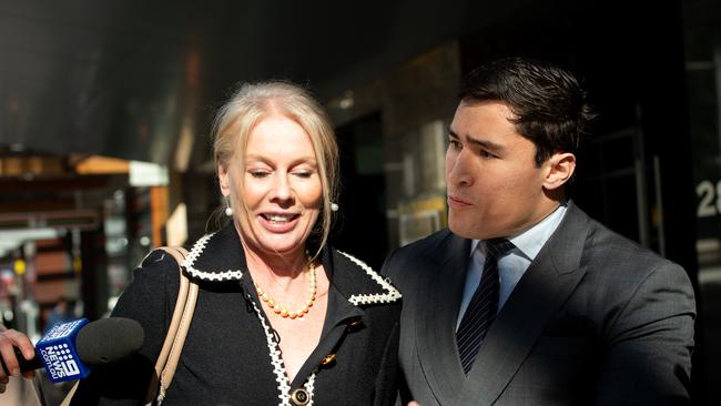 Socialite Shari-Lea Hitchcock outside court with the lawyer.