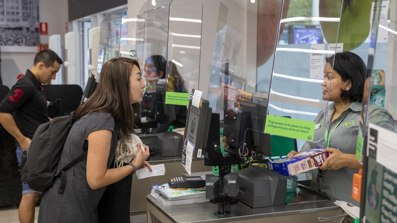 Woolworths has introduced plexiglass screens across its supermarket network to protect workers from being exposed to COVID-19. Picture: Dallas Kilponen