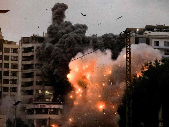 A fireball erupts from the site of an Israeli air strike that targeted the area of Tayouneh in Beirut's southern suburbs. Picture: AFP