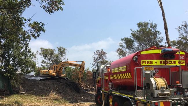 NSW Fire and Rescue help with the mountain of mulch. Picture: Cr Nathan Tilbury