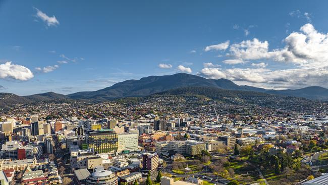 Hobart's Central Business District from the air, against Mount Wellington from the air. Escape 28 January 2024 My Travel CV Photo - iStock