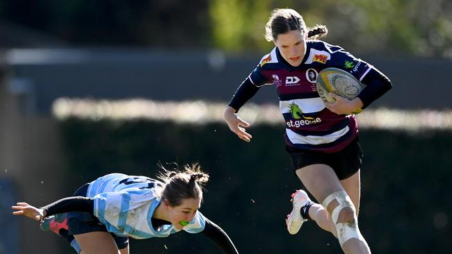 QLD player Leilani Hills with the ball.