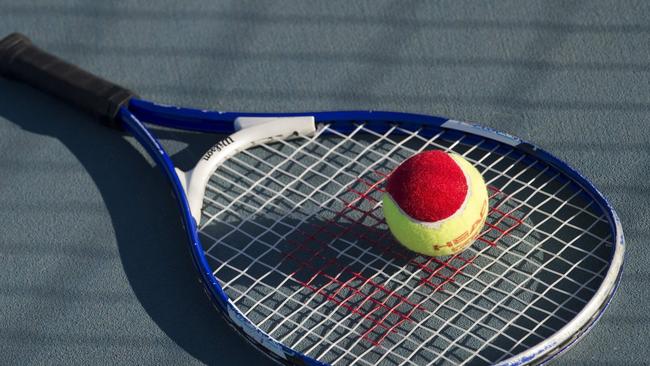 A tennis coach has been charged with indecent assault.