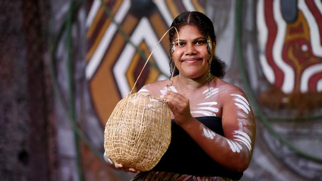 Tjapukai dancer Mary Brin with a weaved basket. PICTURE: STEWART MCLEAN