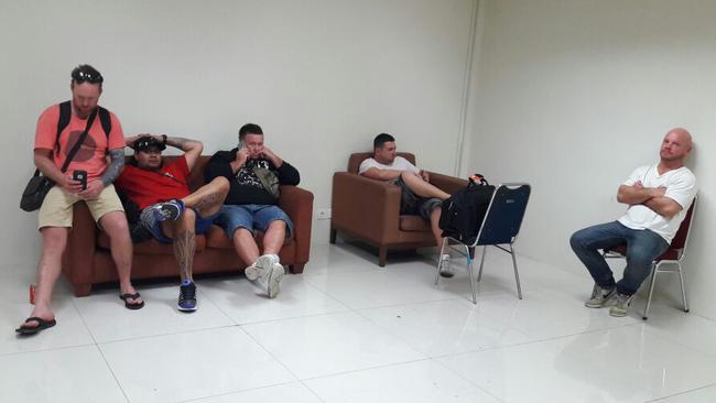 The Australian men taken off a Jetstar flight pictured today in detention holding area in Denpasar airport in Bali. Picture: Supplied