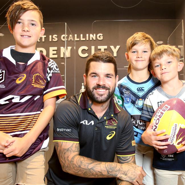 Broncos player Adam Reynolds with brothers Tyler, 11, Mason, 9, and Beau Fuller-Sandys, 7 from Kingaroy, at the opening of Rebel Sport's new experience store, rebel Garden City, Thursday 11th November 2021. Photo: Steve Pohlner